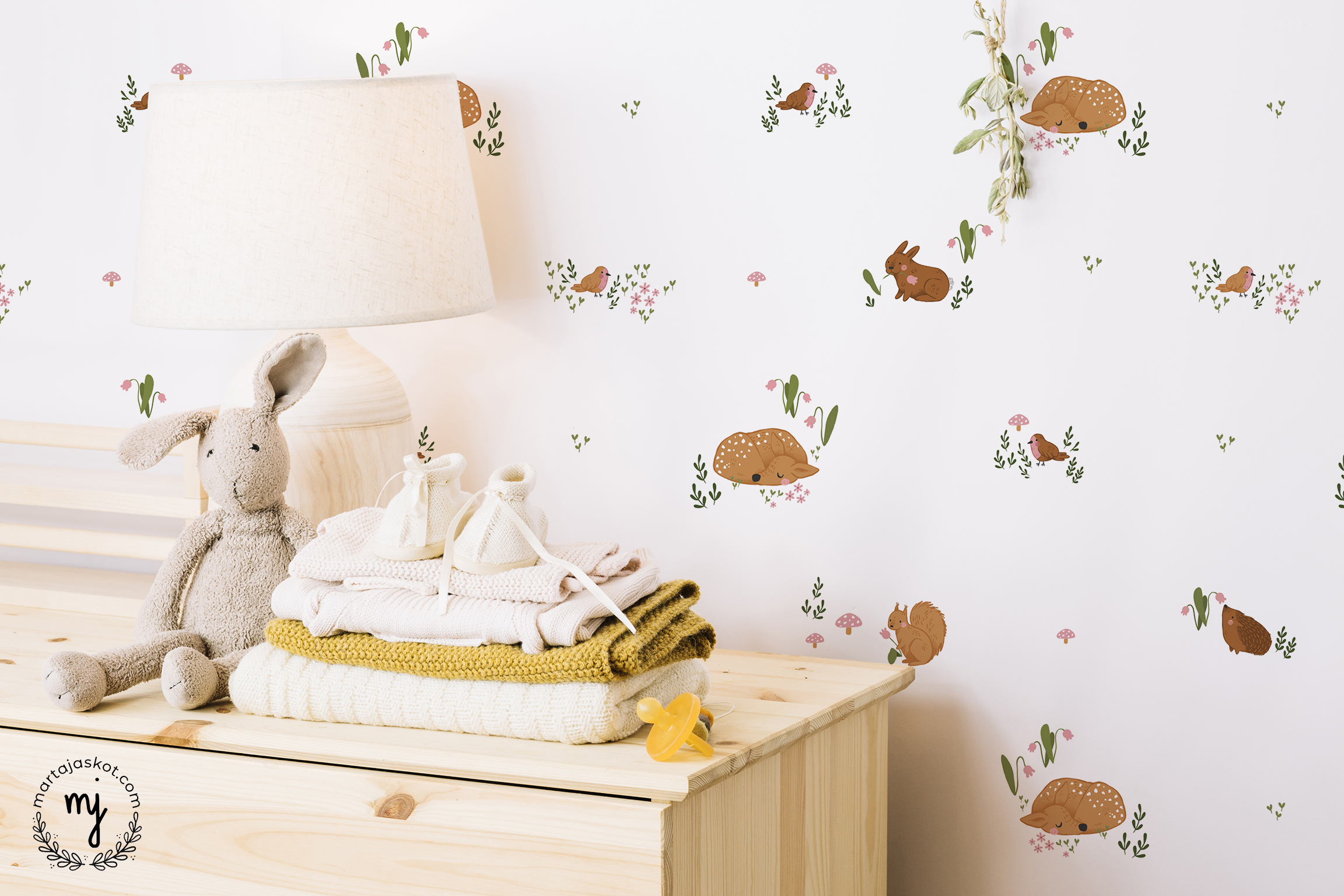Nursery scene with a wallpaper with woodland animals like sleeping fawn, cheeky bunny, red squirrel and flowers smelling hedgehog.